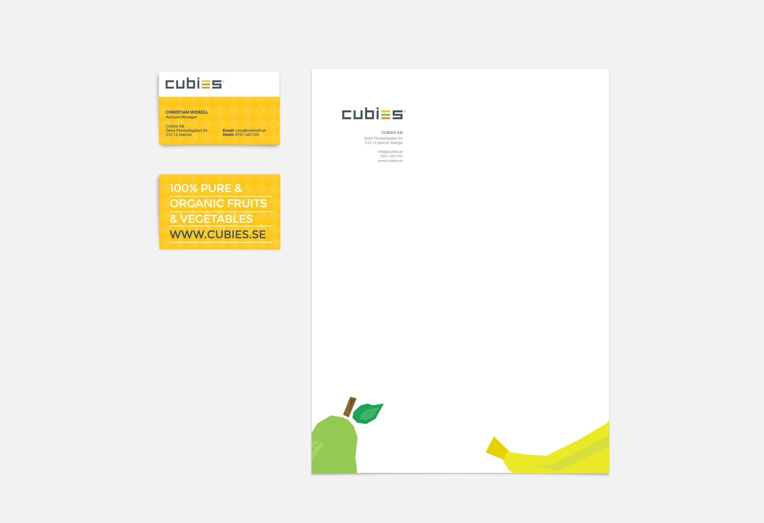 Visitkort och brevpapper i gult och vitt med Cubies logotyp och tecknade frukter