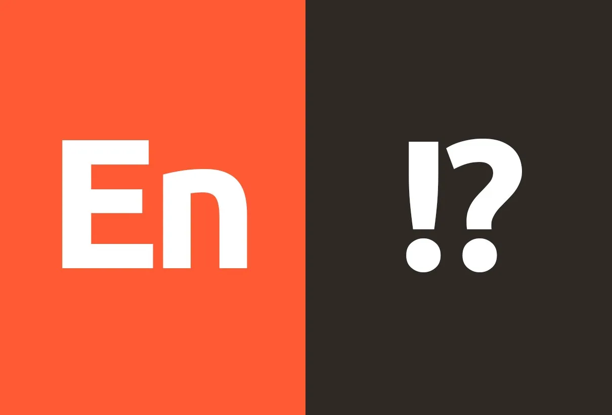 Typografiprov: bokstäverna ”En” i vitt på orange och ”!?” i vitt på mörk botten