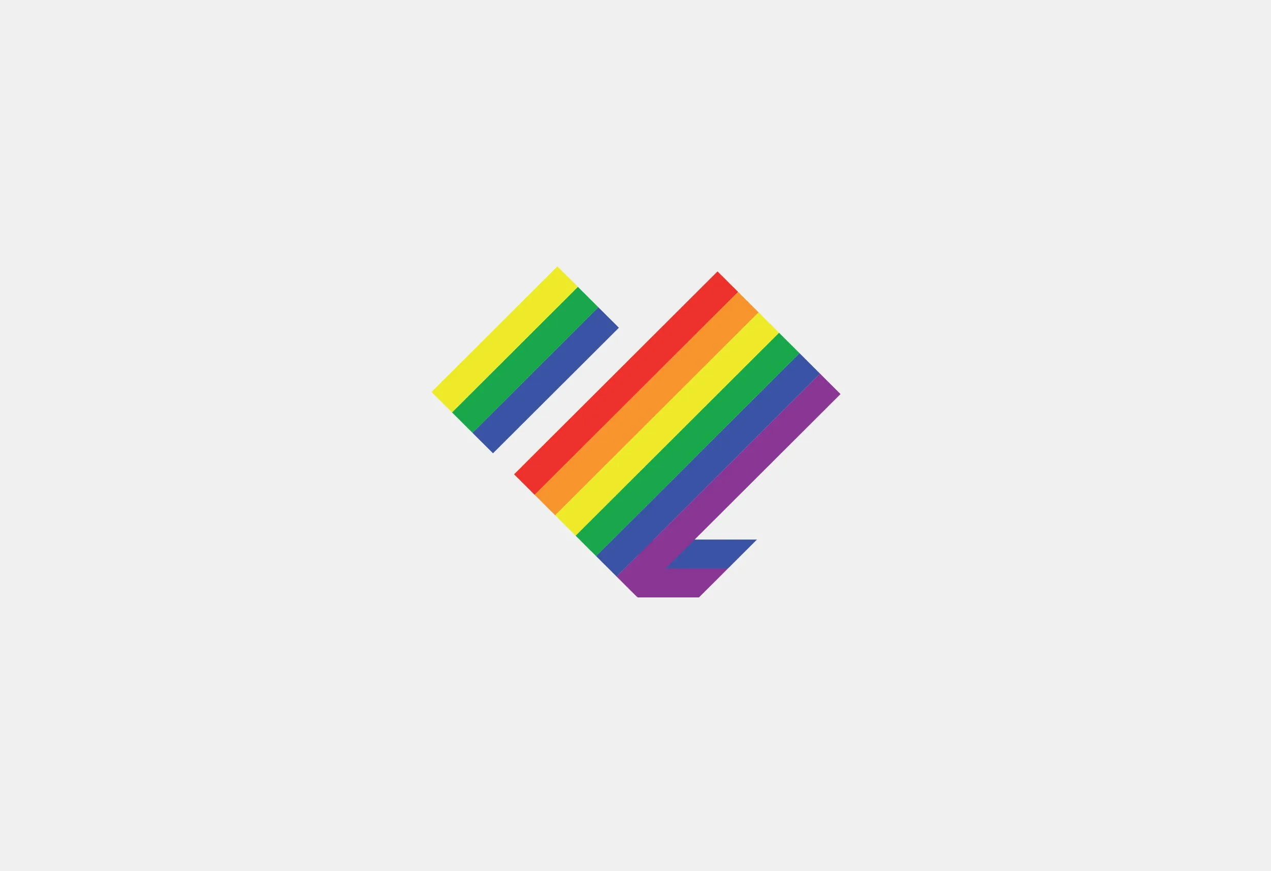Prides symbol, ett stiliserat hjärta i regnbågsfärger, på ljusgrå botten